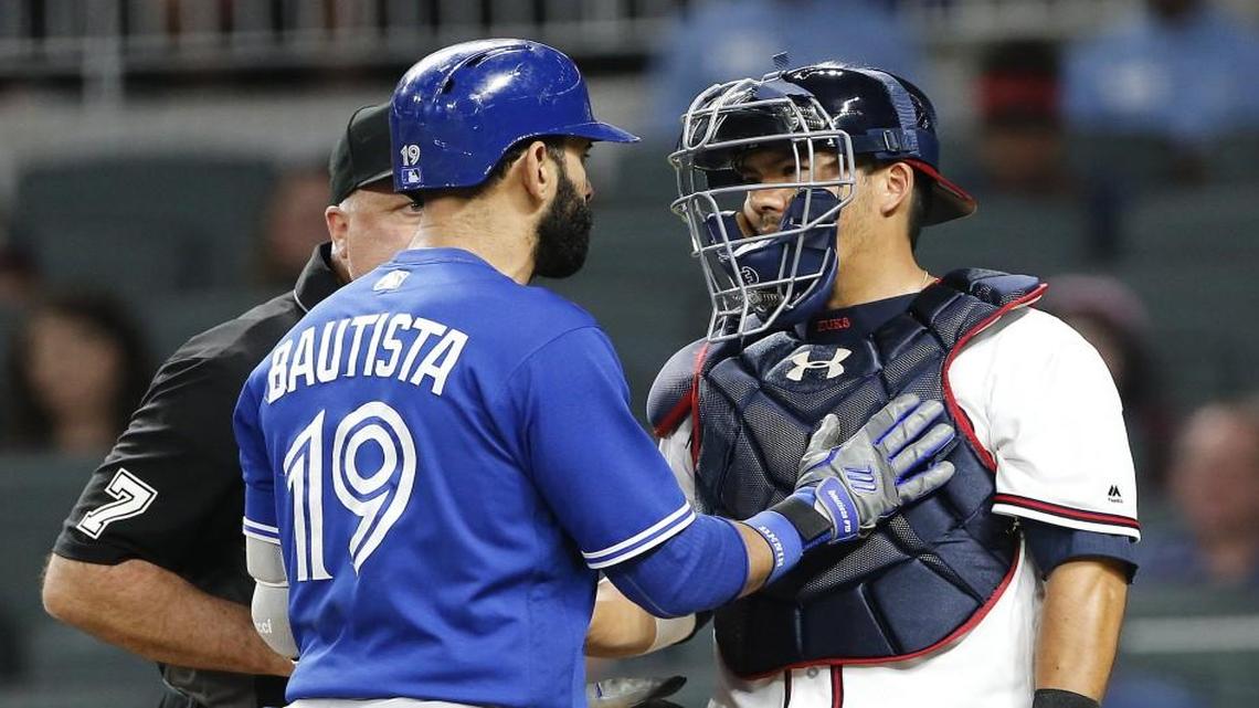 Toronto Blue’s Jose Bautista exchanged words with Atlanta Braves catcher Kurt Suzuki after hitting a home run during Wednesday’s game.