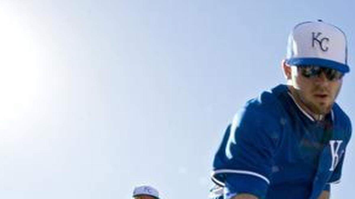 
Kansas City Royals Mike Moustakas reached in to grab his bag and head for the baseball fields during the first full squad day at spring training last year in Surprise, Ariz.
