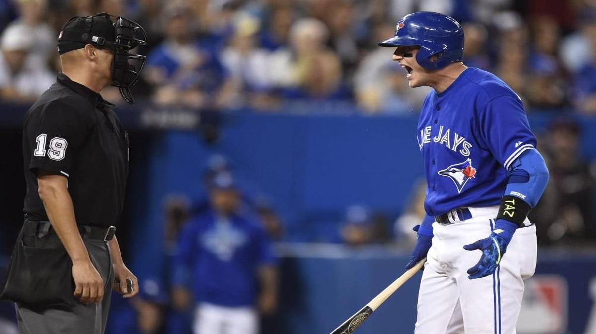 
Toronto Blue Jays’ Troy Tulowitzki (right) yelled at the umpire after being called out on strikes during the 14th inning of Game 2 of the American League Division Series against the Texas Rangers.
