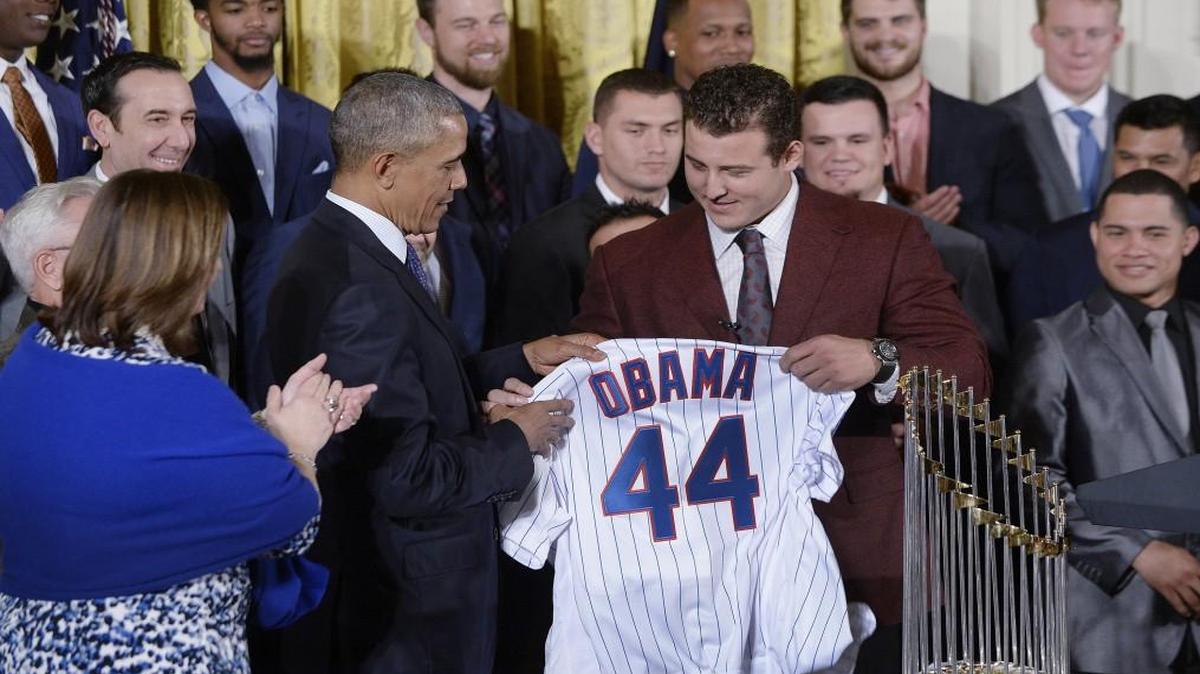 President Barack Obama received a jersey as he welcomes the Chicago Cubs to the White House on Monday.