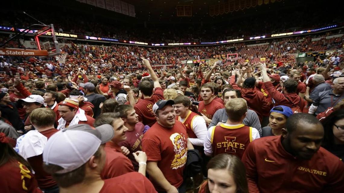 Iowa State fans celebrated on the court at Hilton Coliseum after the Cyclones beat Iowa 83-82 on Thursday.