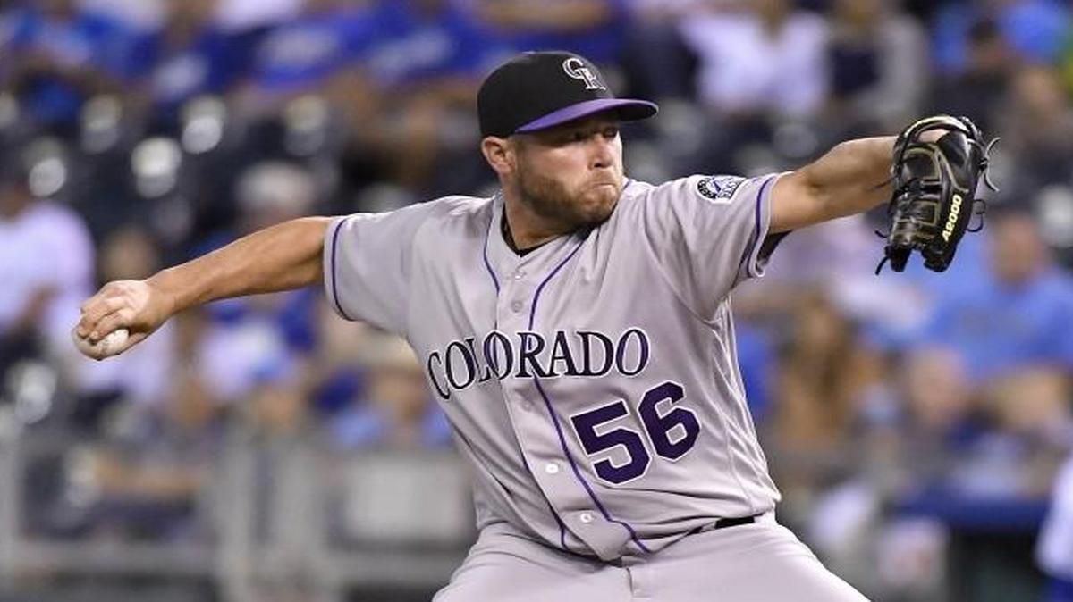 Colorado Rockies relief pitcher Greg Holland threw in the ninth inning on Wednesday.