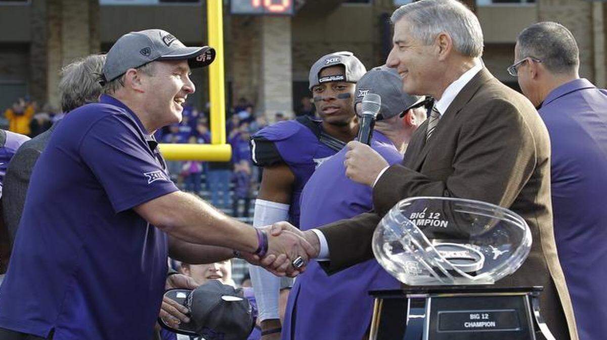 
TCU head football coach Gary Patterson shook hands with Big 12 commissioner Bob Bowlsby before the Horned Frogs receive the Big 12 champions trophy in December.

