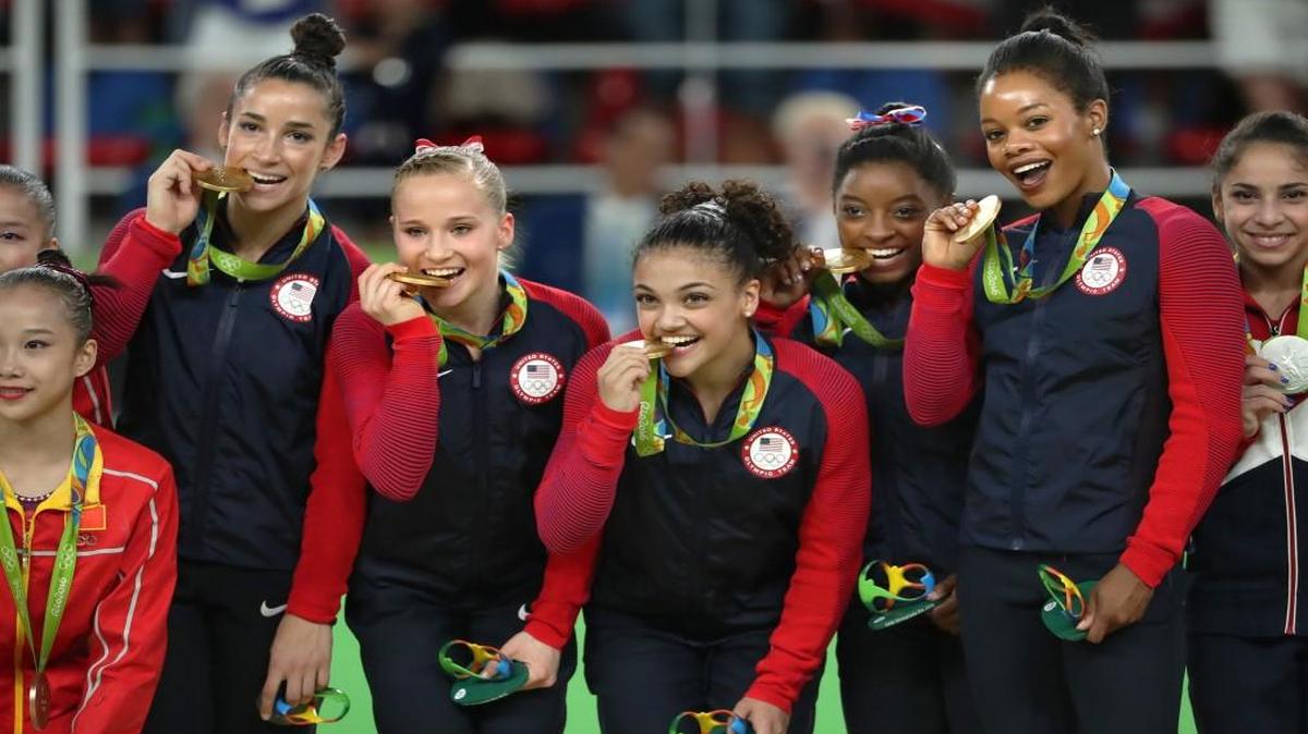From left, Aly Raisman, Madison Kocian, Laurie Hernandez, Simone Biles and Gabby Douglas celebrated on the medal stand on Tuesday.