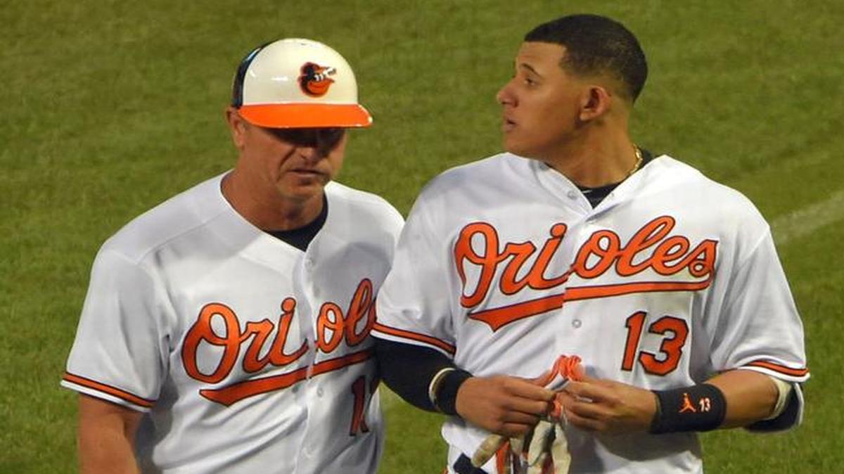 Baltimore Orioles batter Manny Machado (right) with third-base coach Bobby Dickerson during Tuesday’s game.