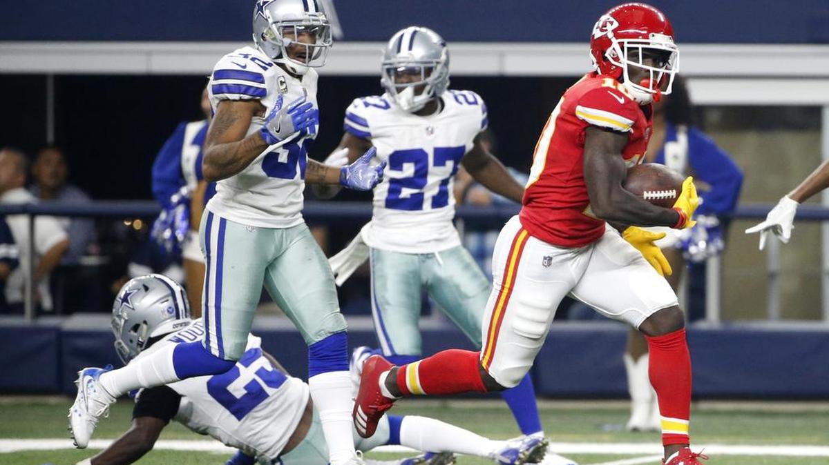 Dallas Cowboys' Xavier Woods (25), Orlando Scandrick (32) and Jourdan Lewis (27) are unable to stop Kansas City Chiefs' Tyreek Hill (10) from reaching the end zone for a touchdown on a long run late in the first half of an NFL football game, Sunday, Nov. 5, 2017, in Arlington, Texas.