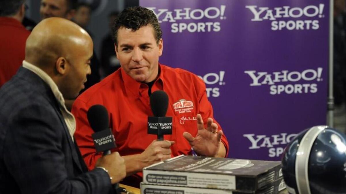 In this photograph taken by AP Images for Papa John’s, CEO John Schnatter (right) talked with former NFL player Tiki Barber in 2011.