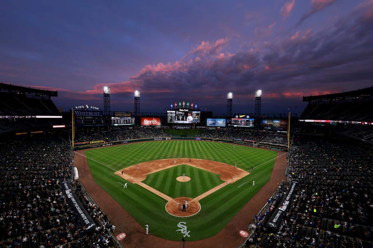 The sun sets over Rate Field during the fifth inning of the game between the Kansas City Royals and the Chicago White Sox on May 12, 2026 in Chicago, Illinois.