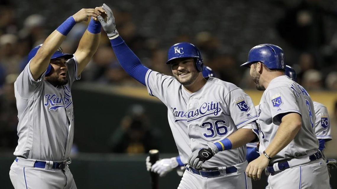 Kansas City Royals catcher Cam Gallagher was congratulated by Melky Cabrera (left) after hitting a grand slam during Monday’s game in Oakland, Calif.