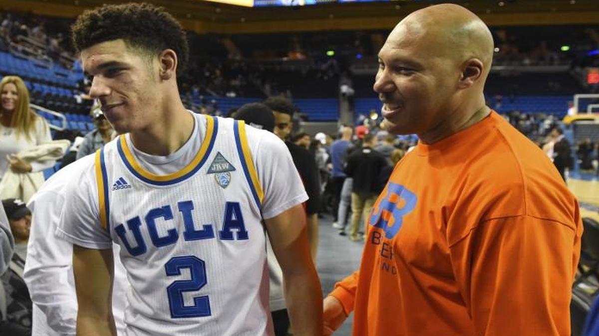 UCLA's Lonzo Ball (center) greets his brother LiAngelo Ball (left) and father LaVar Ball (right) during a game last November.