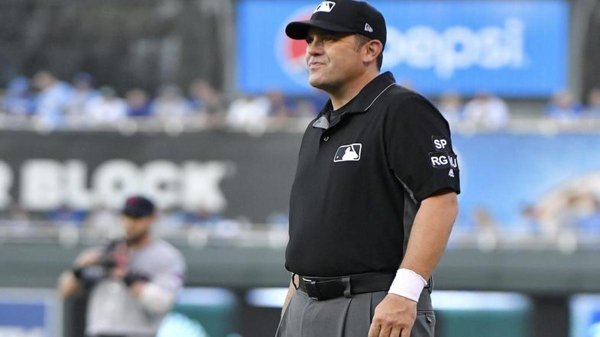 First base umpire Brian Knight wore a white wristband during the Royals’ game at Kauffman Stadium to draw attention to a protest by umpires around baseball. The umpires’ union decried “escalating attacks on umpires” by players.