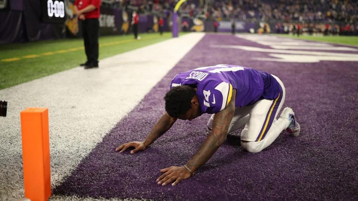 After tossing aside his helmet, Minnesota Vikings receiver Stefon Diggs kneeled in the end zone just after his 61-yard game-winning touchdown on the last play of Sunday’s NFC Divisional playoff against the New Orleans Saints.