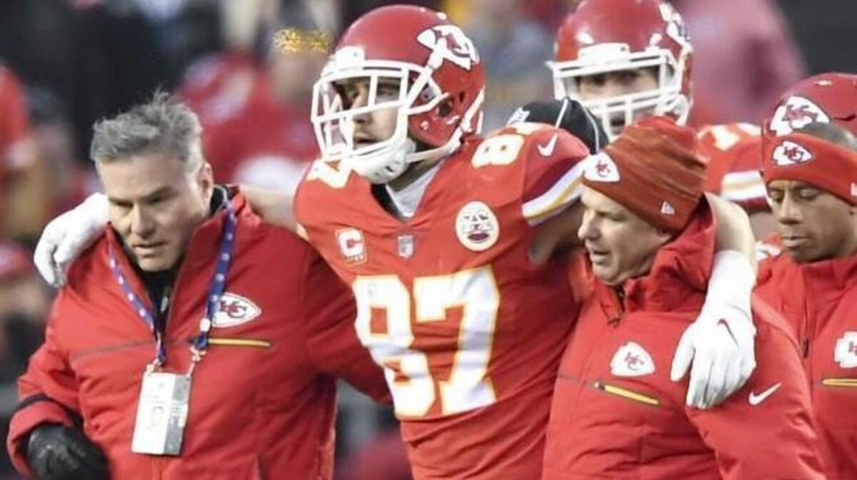 Kansas City Chiefs tight end Travis Kelce was helped off the field following a hit by Tennessee’s Johnathan Cyprien in the second quarter of Saturday’s game..