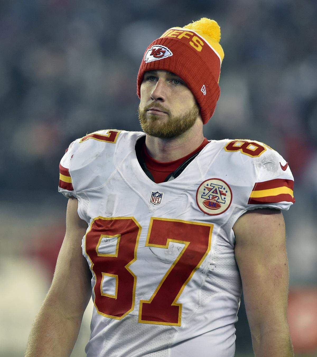 Kansas City Chiefs tight end Travis Kelce (87) walks off the field after the teams 27-20 loss to the New England Patriots during Saturday's AFC divisional playoff football game on Jan. 16, 2016 at Gillette Stadium in Foxborough, Mass.
