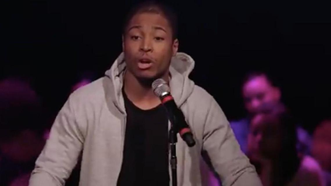 Tyler Lockett performing his poem.