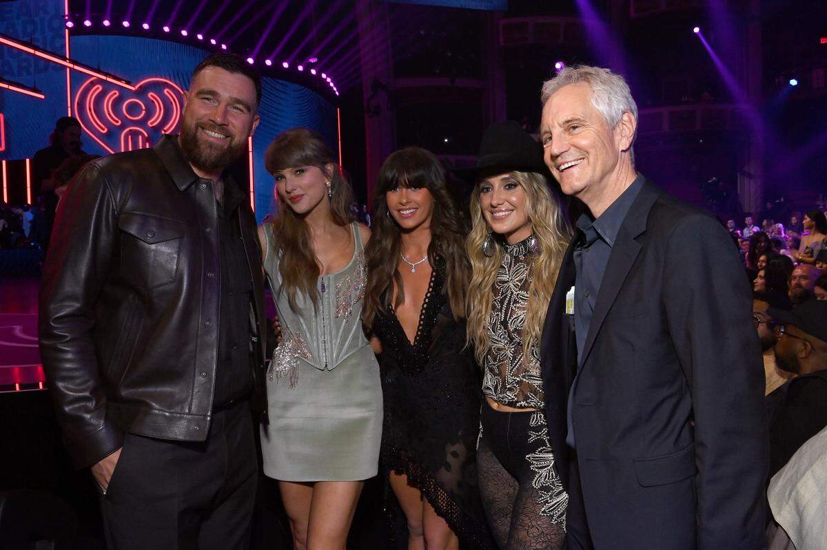 Travis Kelce (from left to right), Taylor Swift, Ella Langley, Lainey Wilson, and John Sykes, President, Entertainment Enterprises for iHeartMedia, Inc. attend the 2026 iHeartRadio Music Awards at Dolby Theatre on March 26, 2026 in Los Angeles, California.
