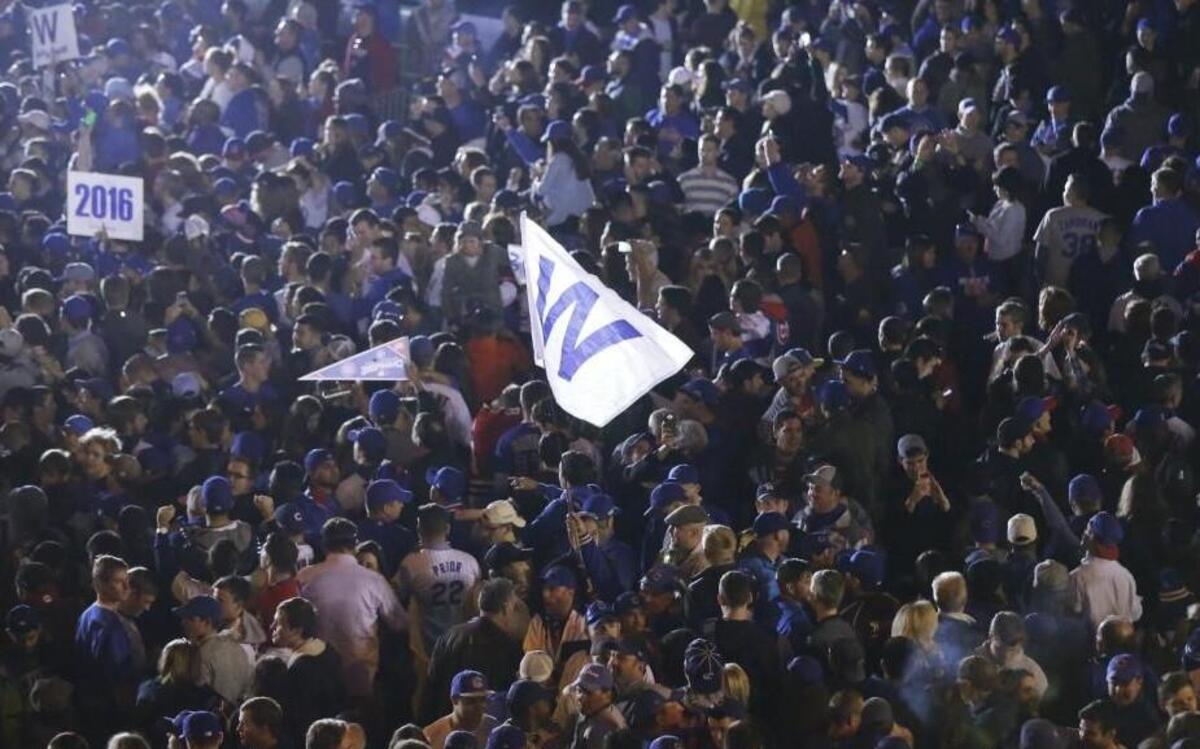 Fans celebrate on the street outside Wrigley Field after Game 6 of the National League Championship Series.