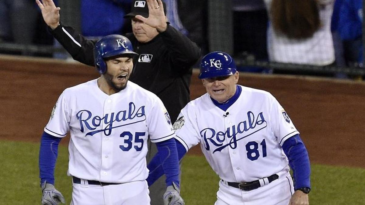 Kansas City Royals first baseman Eric Hosmer was congratulated by first base coach Rusty Kuntz after Hosmer hit a two-run RBI single in the fifth inning during Game 2 of the World Series at Kauffman Stadium.