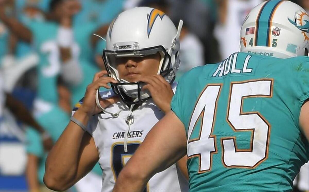Los Angeles Chargers kicker Younghoe Koo walked off the field after missing a field goal attempt against the Miami Dolphins on Sunday in Carson, Calif.