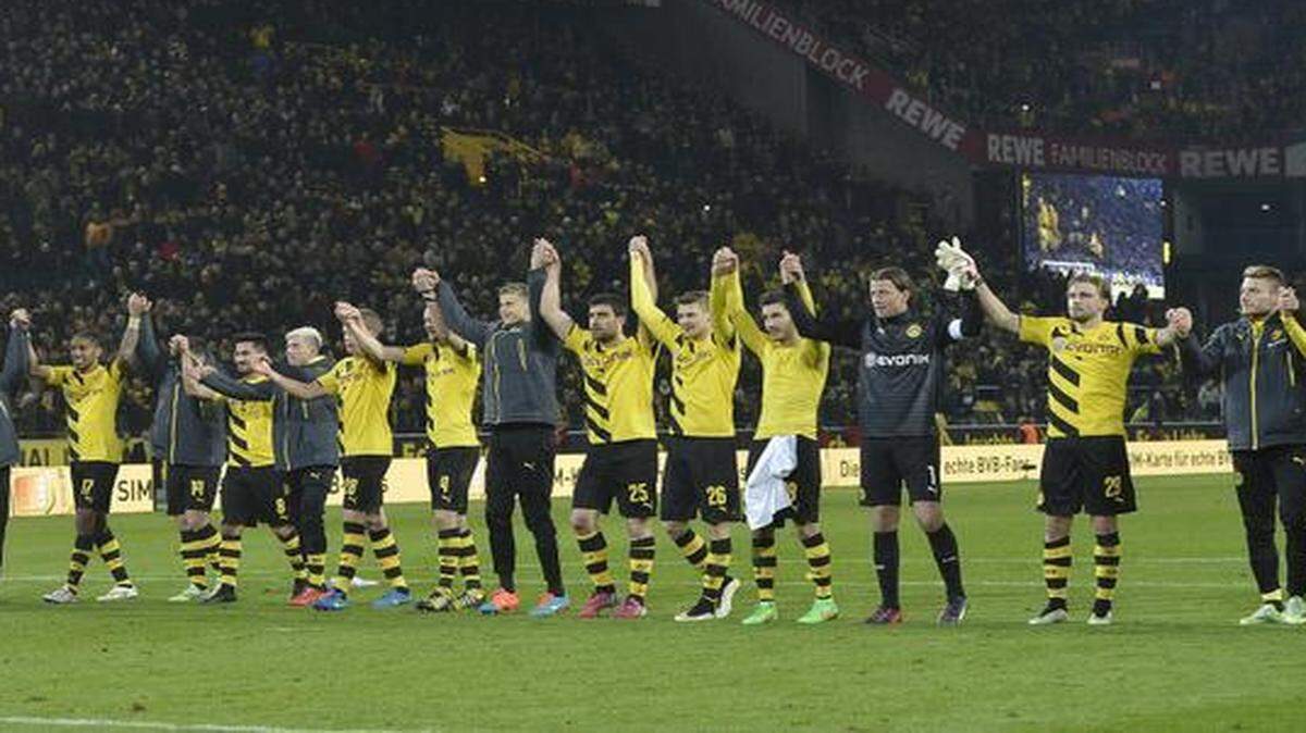 
Dortmund’s team receive applause from supporters after winning a gamer earlier this month against Mainz.
