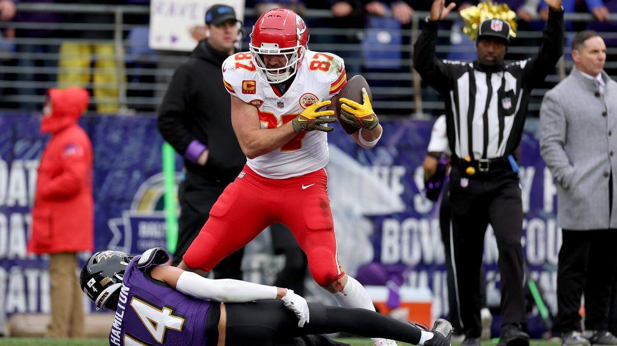 Chiefs tight end Travis Kelce celebrates after catching a touchdown pass against Kyle Hamilton #14 of the Baltimore Ravens during the first quarter in the AFC Championship Game at M&T Bank Stadium on Jan. 28, 2024 in Baltimore, Maryland.