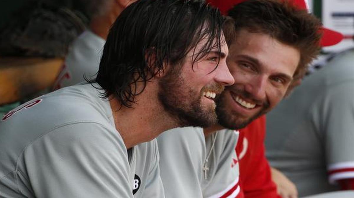 
Philadelphia Phillies starting pitcher Cole Hamels (left) sat with Jeff Francoeur in the dugout during a game on June 14.

