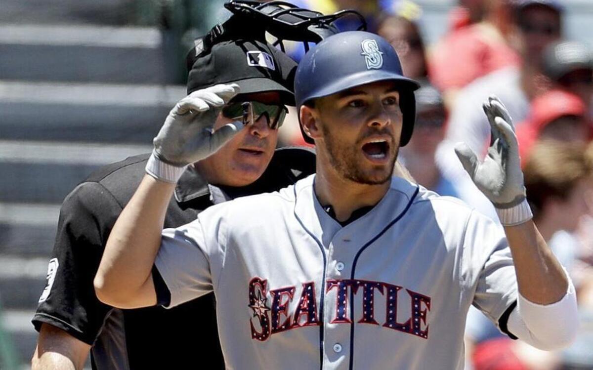 This photo is from Sunday’s game between the Mariners and Angels and Seattle’s Danny Valencia was unhappy about being called out on strikes.
