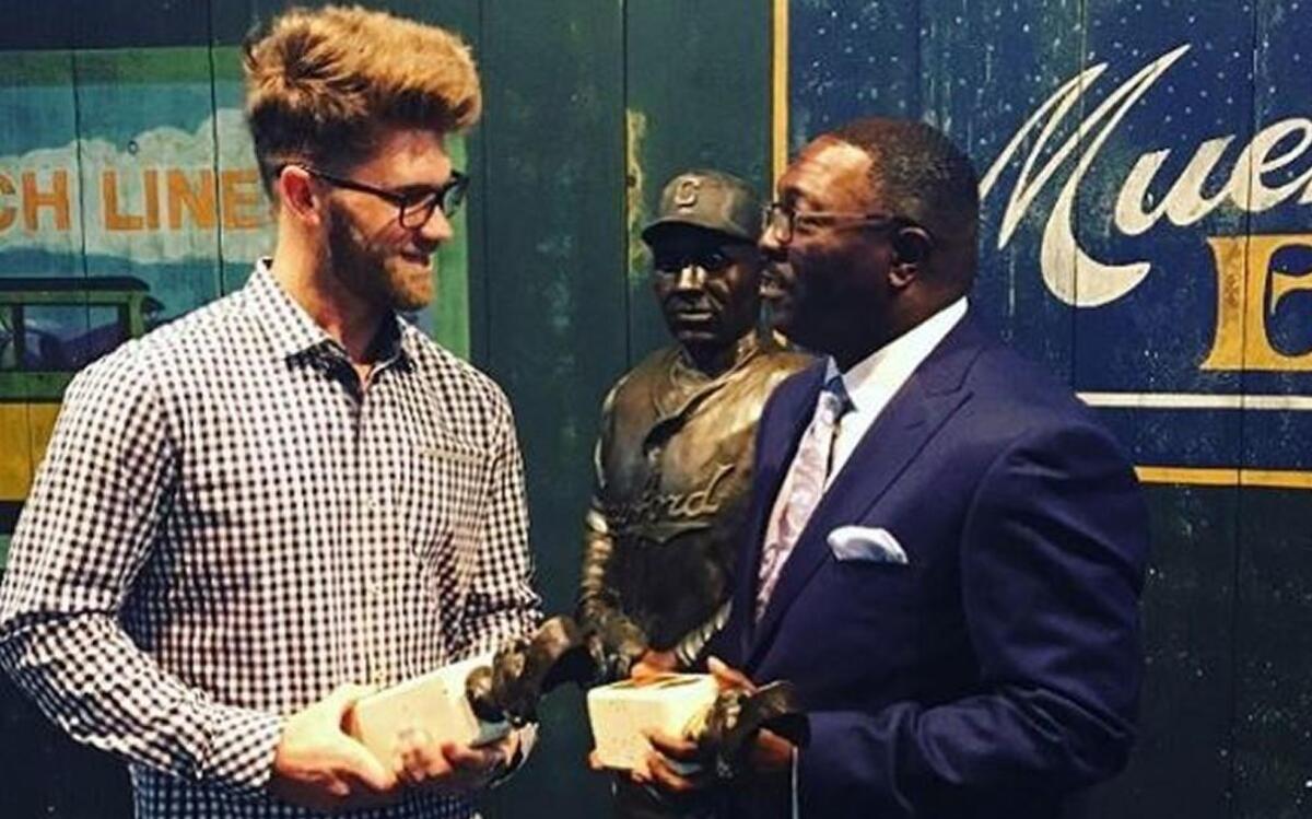 Washington Nationals star Bryce Harper with Negro Leagues Baseball Museum president Bob Kendrick.