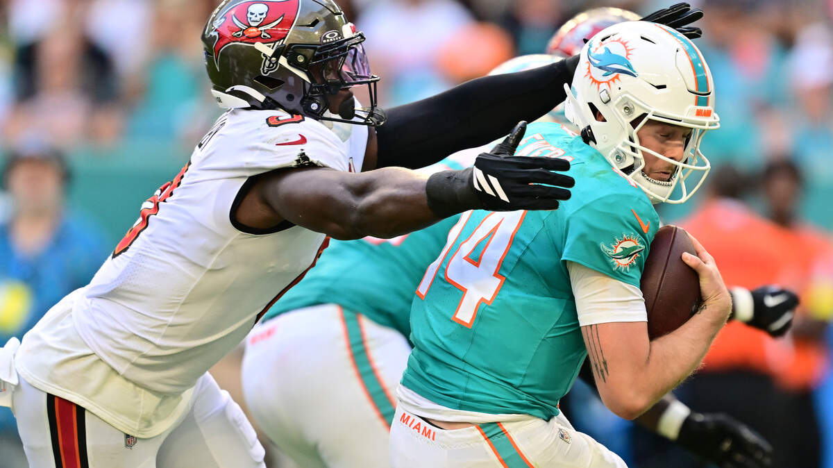 Yaya Diaby of the Tampa Bay Buccaneers sacks Quinn Ewers of the Miami Dolphins during the third quarter at Hard Rock Stadium on Dec. 28, 2025 in Miami Gardens, Florida.