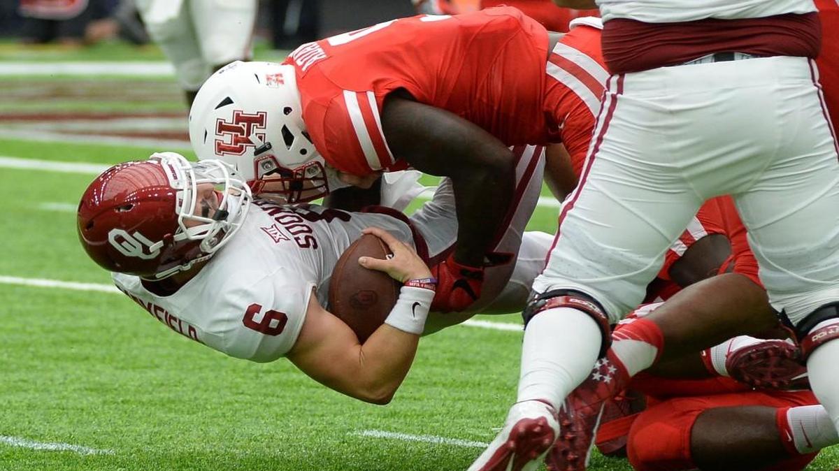 Oklahoma quarterback Baker Mayfield was tackled by Houston linebacker Matthew Adams during Saturday’s game.
