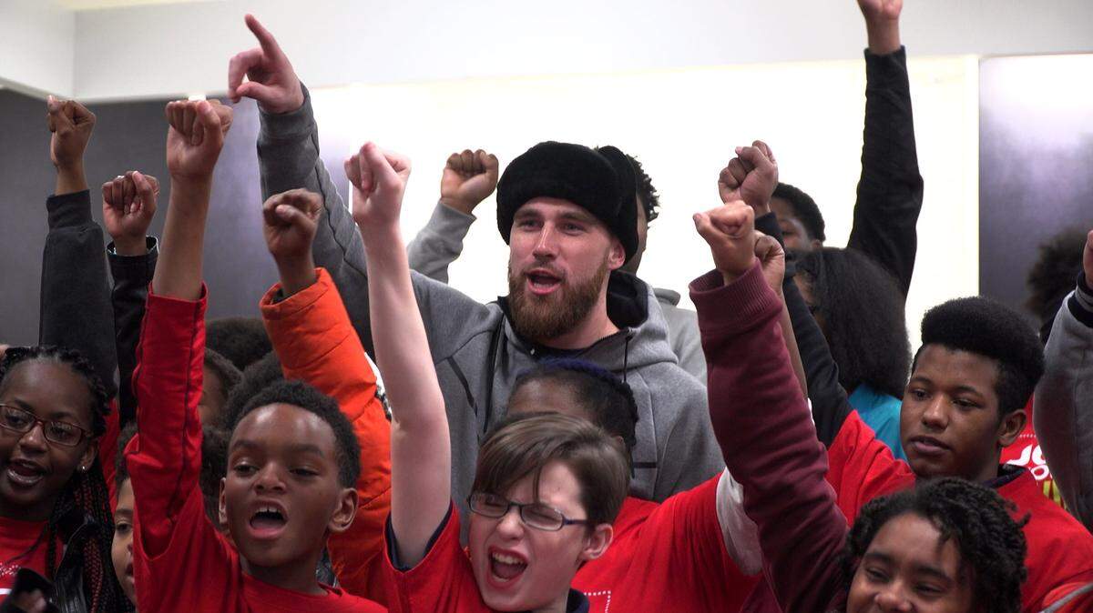 Chiefs tight end Travis Kelce surprised about 50 kids from Linwood YMCA, helping them select holiday gifts for their family and friends in 2016.