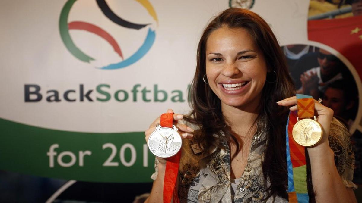 This March 25, 2009 file photo shows Jessica Mendoza with her Olympic gold and silver medals that she won with the U.S. softball team.
