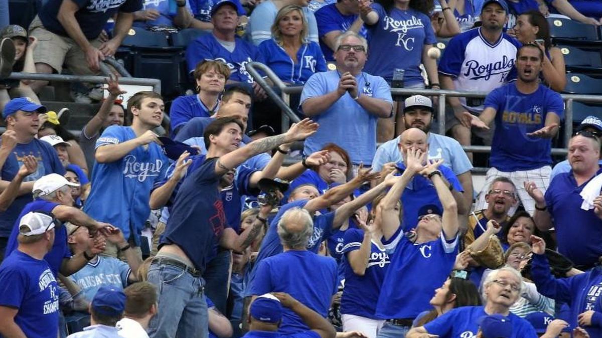 
Fans tred to catch a foul ball off the bat of Kansas City Royals designated hitter Kendrys Morales during a game this season.
