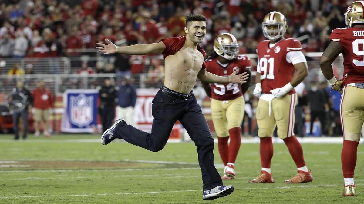 A fan ran on the filed during the second half of the Rams-49ers game on Sept. 12.