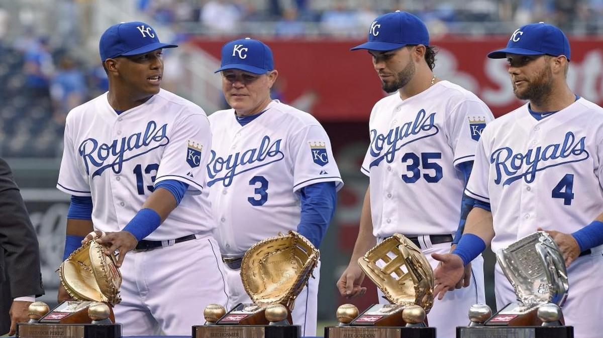 As manager Ned Yost watched, Kansas City Royals catcher Salvador Perez, first baseman Eric Hosmer and left fielder Alex Gordon received their Gold Gloves before Friday’s baseball game against the Oakland Athletics on April 17, 2015 at Kauffman Stadium.