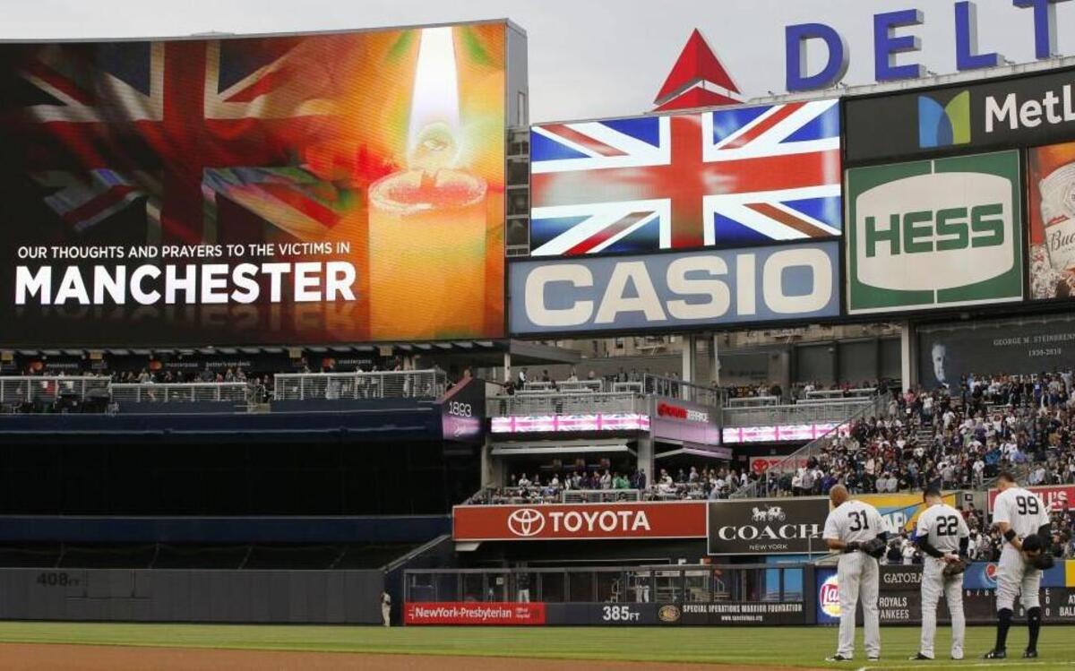 New York Yankees outfielders players stood at attention as the British national anthem was played before Tuesday’s game against the Royals.