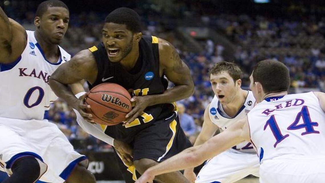 
Kansas’ Thomas Robinson (0), Brady Morningstar (12) and Tyrel Reed (14) tried to slow VCU forward Jamie Skeen (21) as he drove toward the basket during an Elite Eight game in 2011.

