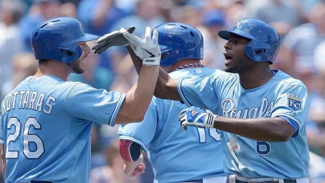 Kansas City Royals' Lorenzo Cain celebrated his Sonic Slam grand slam in with George Kottaras (from left), Billy Butler and Eric Hosmer on July 4, 2013, at Kauffman Stadium.