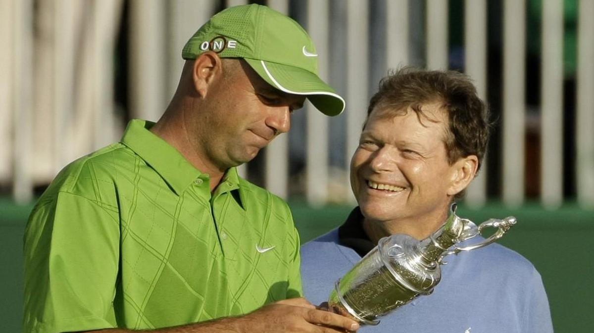 In this July 19, 2009 file photo, Stewart Cink held the trophy as runner-up Tom Watson offered congratulations after a playoff following the final round of the British Open.
