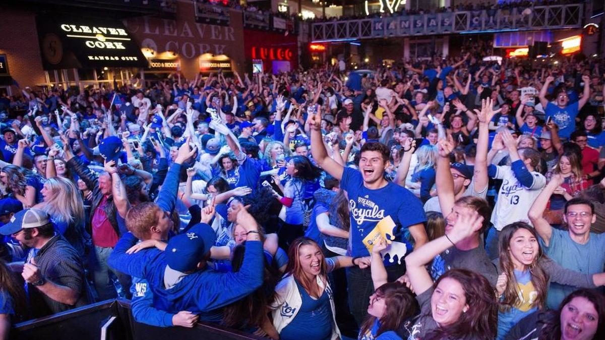 Kansas City Royals fans celebrate at the Kansas City Power & Light District after the Kansas City Royals beat the Toronto Blue Jays 4-3 and advanced to the World Series.