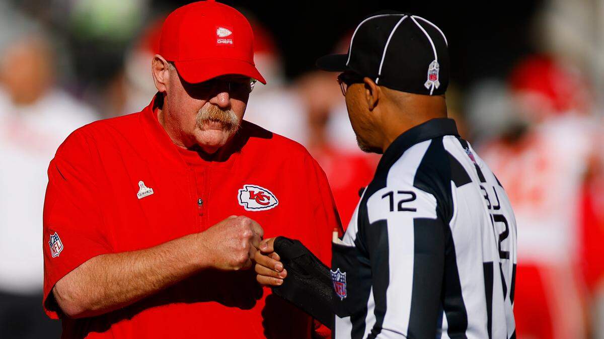 Chiefs head coach Andy Reid speaks with back judge Greg Steed before the game against the Denver Broncos at Empower Field At Mile High on Nov. 16, 2025 in Denver, Colorado.