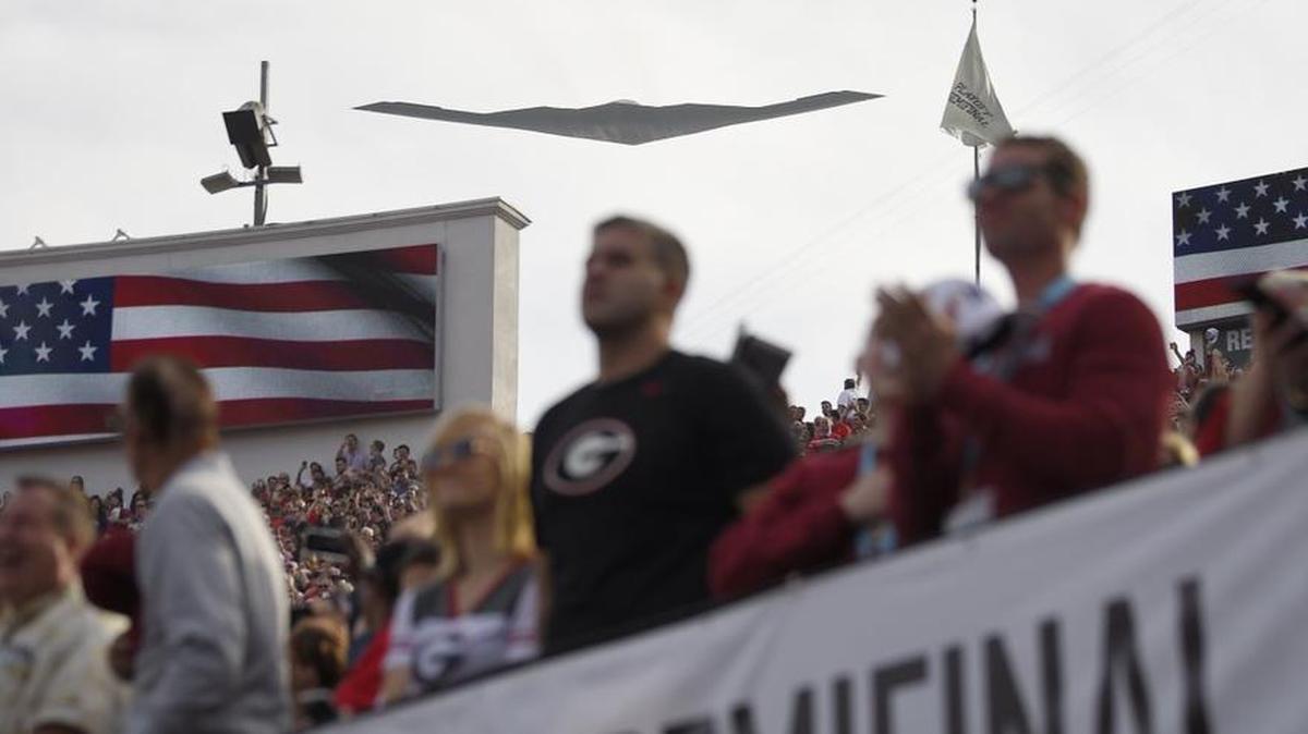A B-2 stealth bomber makes a flyover before kickoff of the Rose Bowl on Monday.