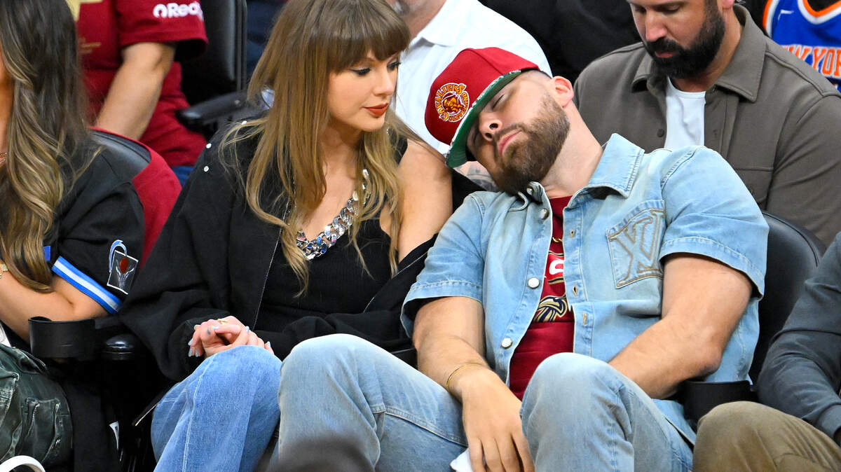 Chiefs tight end Travis Kelce (right) reacts as singer Taylor Swift (left) looks on during the fourth quarter in Game Three between the New York Knicks and the Cleveland Cavaliers in the NBA Eastern Conference Finals at Rocket Arena on May 23, 2026 in Cleveland, Ohio.
