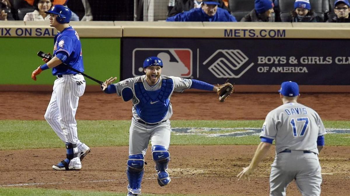 Kansas City Royals catcher Drew Butera ran toward relief pitcher Wade Davis after the Royals defeated the New York Mets 7-2 and the World Series on Sunday at Citi Field in New York.