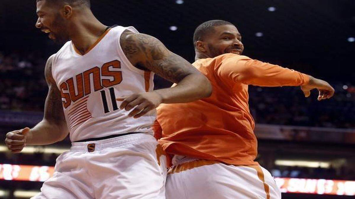 
Phoenix Suns forward Markieff Morris (left) and Marcus Morris celebrated after defeating the Dallas Mavericks in a game last month.
