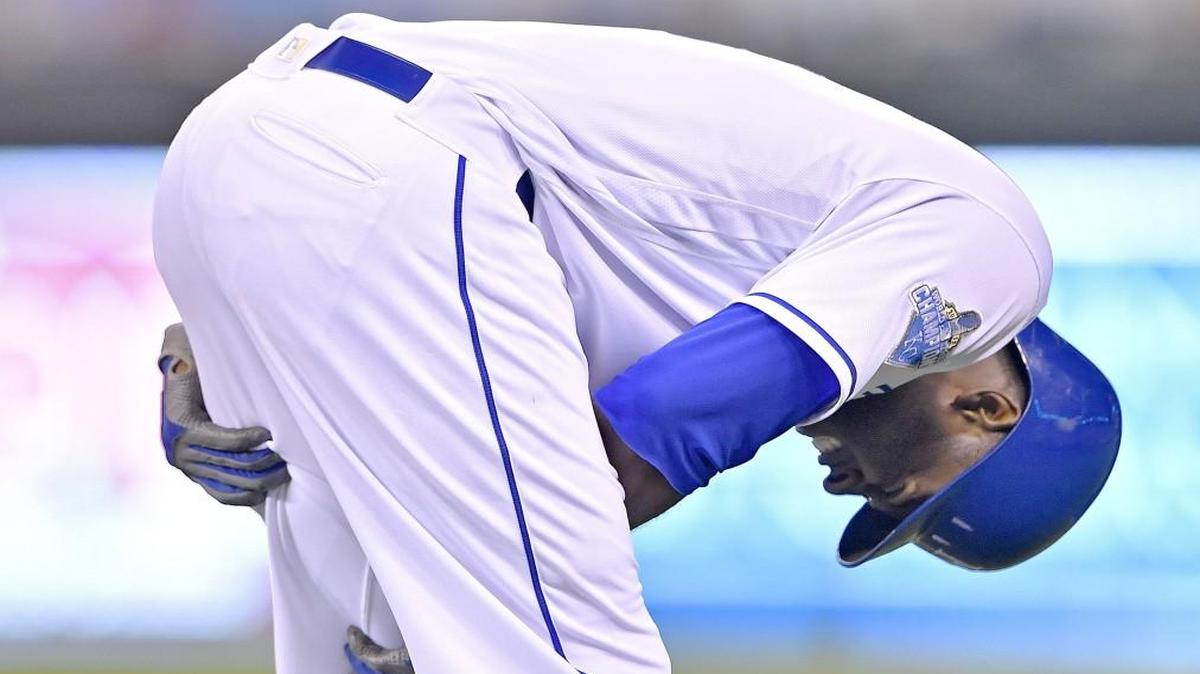 Kansas City Royals outfielder Lorenzo Cain grabbed his leg after grounding out in the seventh inning of Tuesday’s game against the St. Louis Cardinals. Cain was helped off the field by the training staff.