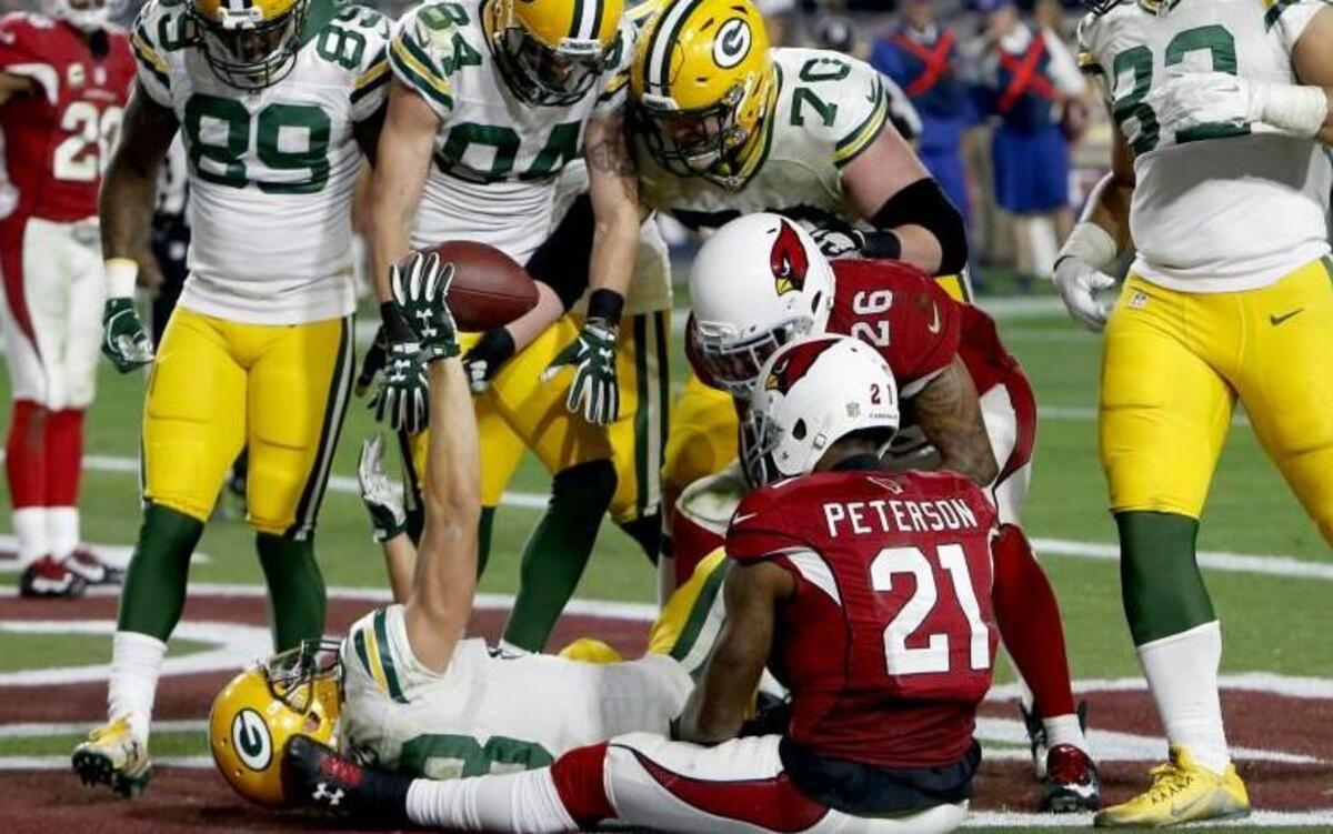 Green Bay Packers wide receiver Jeff Janis helds the football after making a catch for a touchdown on the final play of regulation.