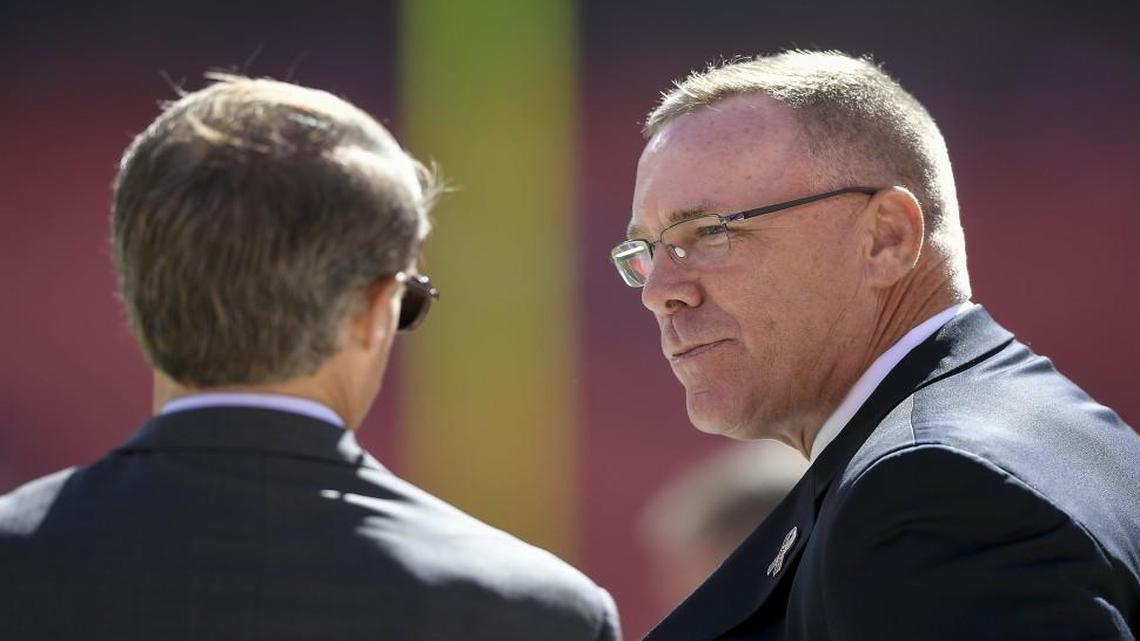 Former Kansas City Chiefs general manager John Dorsey (right) spoke with Chiefs chairman and CEO Clark Hunt prior to the home opener against the San Diego Chargers on Sept. 11, 2016 at Arrowhead Stadium.