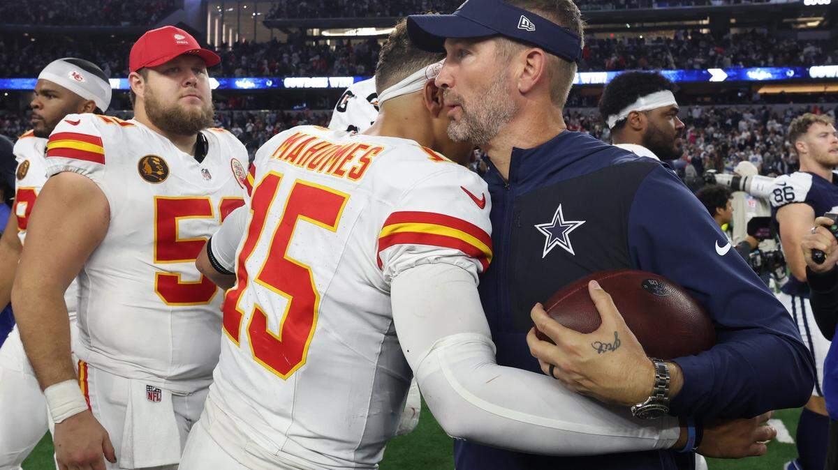 Chiefs quarterback Patrick Mahomes and Cowboys coach Brian Schottenheimer embraced following the game at AT&T Stadium on Nov. 27, 2025 in Arlington, Texas.