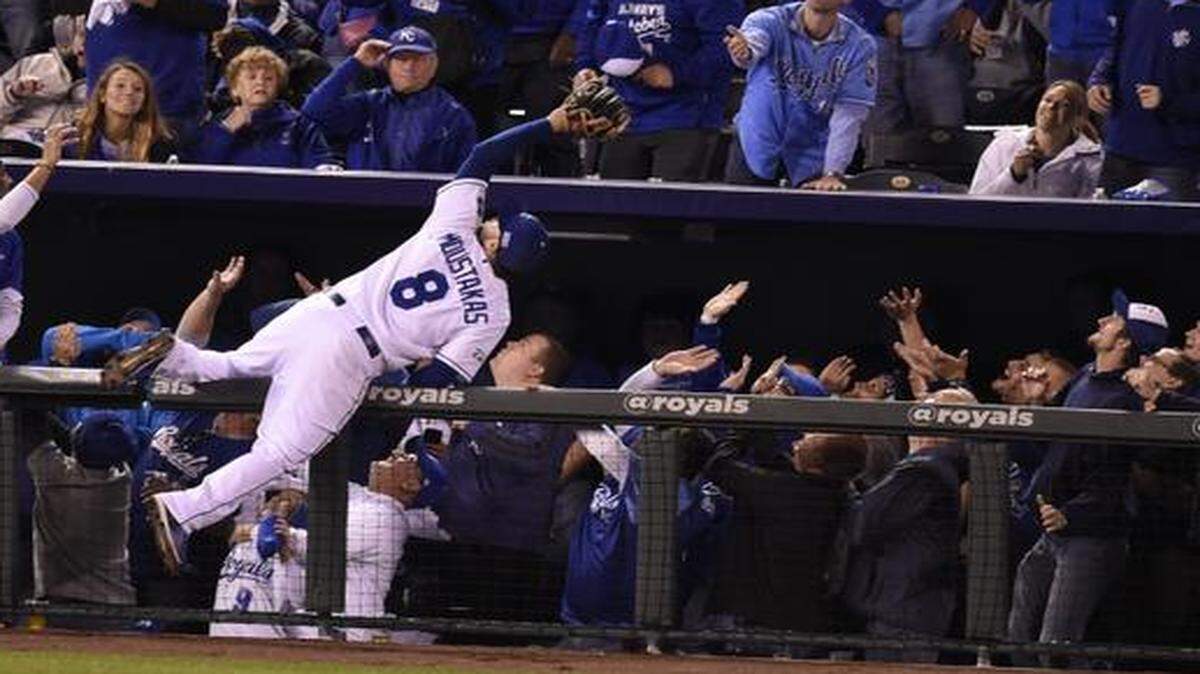 
Kansas City Royals third baseman Mike Moustakas went airborne to make a catch on a foul ball hit by the Orioles’ Adam Jones in the sixth inning of game three of the American League Championship Series.
